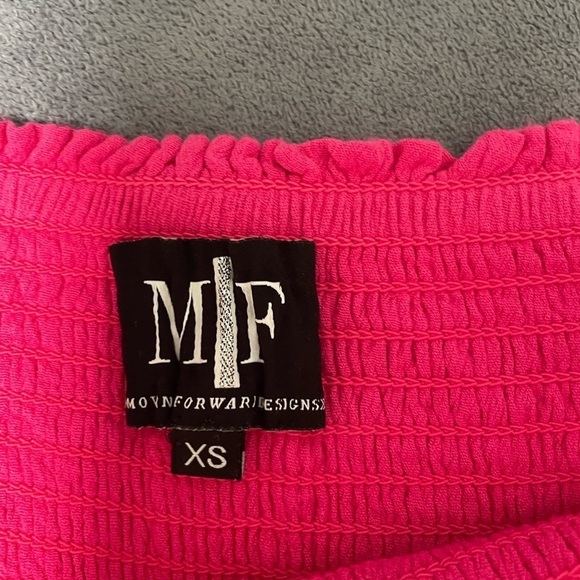 MF Designs high-low smock waist tiered ruffle skirt in pink. Size X-Small - Picture 6 of 7